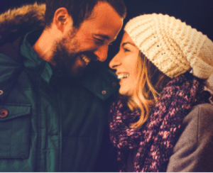 A man and woman smiling